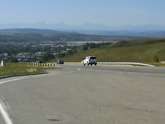 Alberta 100 Cochrane With Rockies On Horizon.jpg